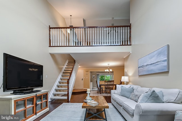 2012 Quay Village Ct Unit 202, Annapolis, MD 21403 - living room with wood finished floors, a chandelier, a high ceiling, and stairs