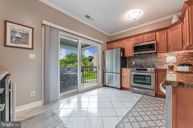2012 Quay Village Ct Unit 202, Annapolis, MD 21403 - kitchen with appliances with stainless steel finishes, tasteful backsplash, crown molding, light tile patterned flooring, and baseboards