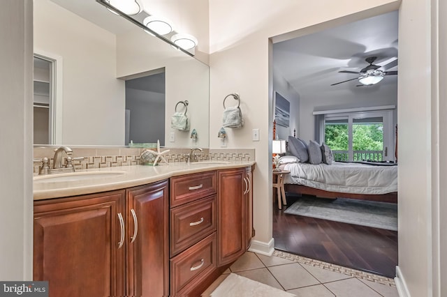 2012 Quay Village Ct Unit 202, Annapolis, MD 21403 - bathroom with tile patterned flooring, double vanity, ensuite bath, ceiling fan, and backsplash