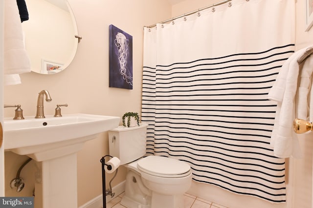 2012 Quay Village Ct Unit 202, Annapolis, MD 21403 - full bathroom featuring tile patterned floors, toilet, baseboards, curtained shower, and a sink