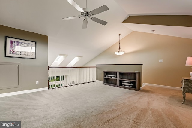 2012 Quay Village Ct Unit 202, Annapolis, MD 21403 - unfurnished living room with ceiling fan, vaulted ceiling, carpet floors, and baseboards