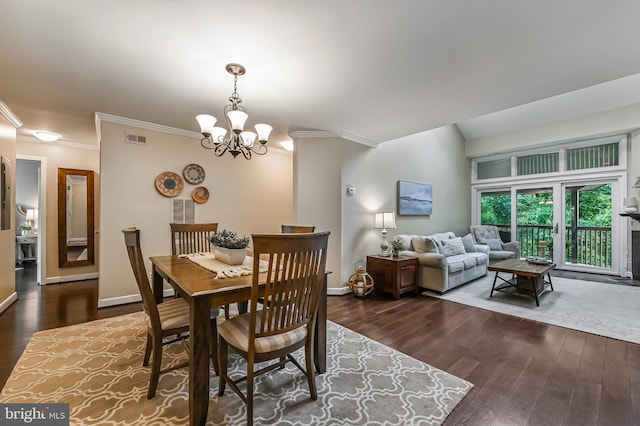 2012 Quay Village Ct Unit 202, Annapolis, MD 21403 - dining area with ornamental molding, dark wood-type flooring, a chandelier, and baseboards