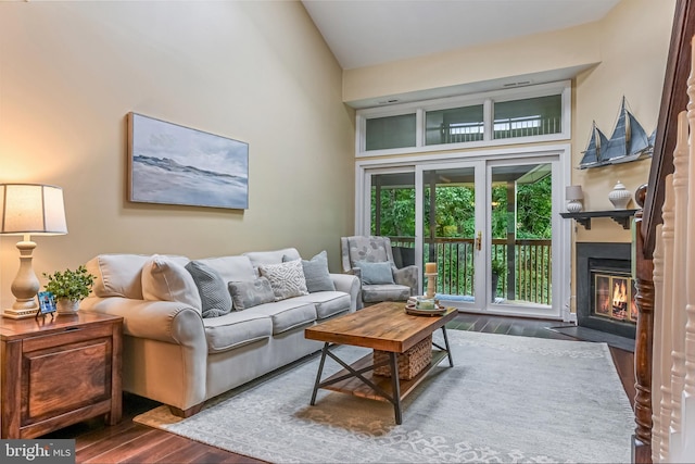 2012 Quay Village Ct Unit 202, Annapolis, MD 21403 - living area with dark wood-style floors, a high ceiling, and a fireplace with flush hearth