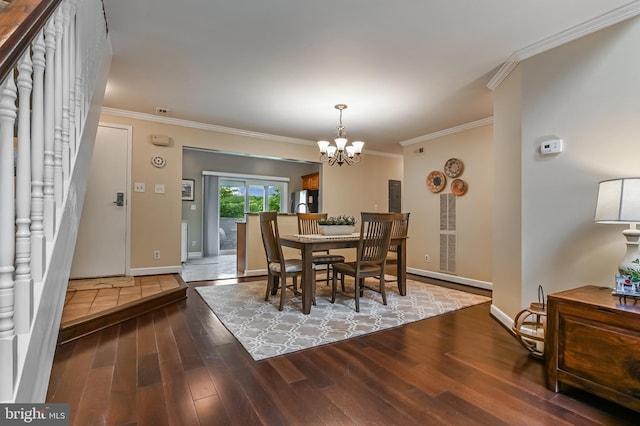 2012 Quay Village Ct Unit 202, Annapolis, MD 21403 - dining space with wood finished floors, ornamental molding, a chandelier, and baseboards