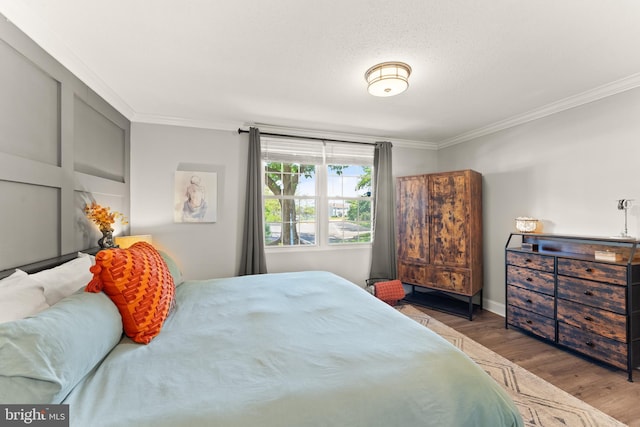 124 Fort Evans Rd SE Unit B, Leesburg, VA 20175 - bedroom featuring crown molding and wood finished floors