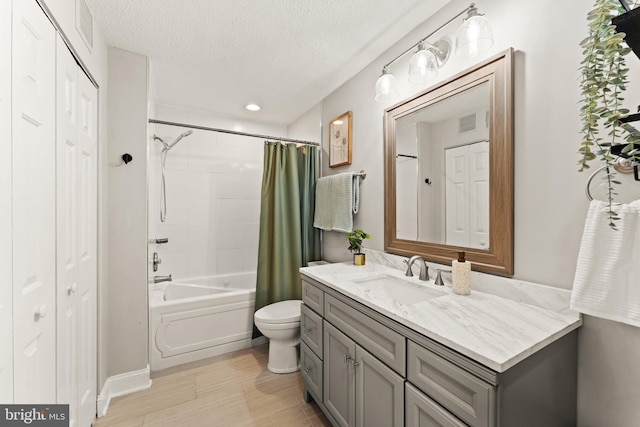124 Fort Evans Rd SE Unit B, Leesburg, VA 20175 - bathroom featuring vanity, toilet, shower / bath combination with curtain, a textured ceiling, and recessed lighting