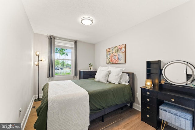 124 Fort Evans Rd SE Unit B, Leesburg, VA 20175 - bedroom with wood finished floors and baseboards