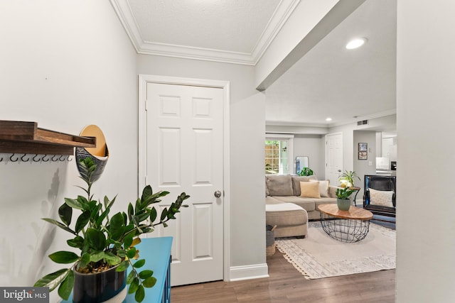 124 Fort Evans Rd SE Unit B, Leesburg, VA 20175 - living area with crown molding, wood finished floors, recessed lighting, and baseboards