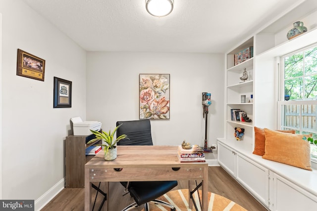 124 Fort Evans Rd SE Unit B, Leesburg, VA 20175 - office featuring wood finished floors, baseboards, and a textured ceiling
