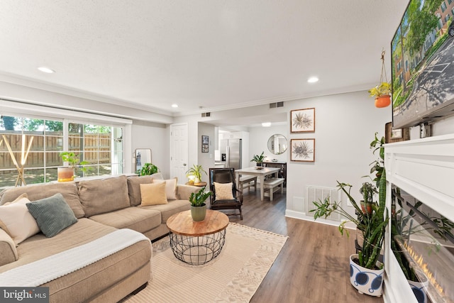 124 Fort Evans Rd SE Unit B, Leesburg, VA 20175 - living area featuring recessed lighting, wood finished floors, a warm lit fireplace, baseboards, and ornamental molding