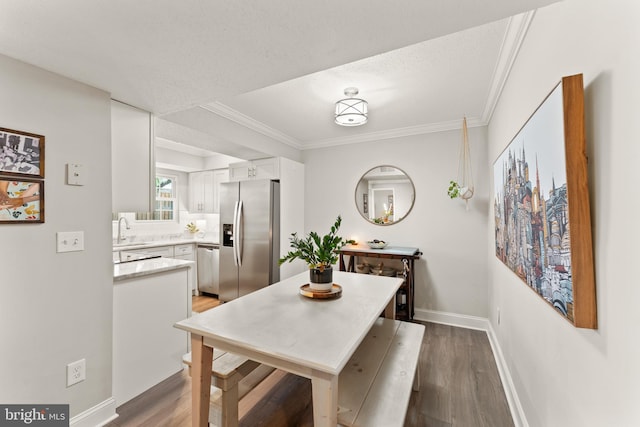 124 Fort Evans Rd SE Unit B, Leesburg, VA 20175 - dining area featuring wood finished floors, ornamental molding, baseboards, and a textured ceiling