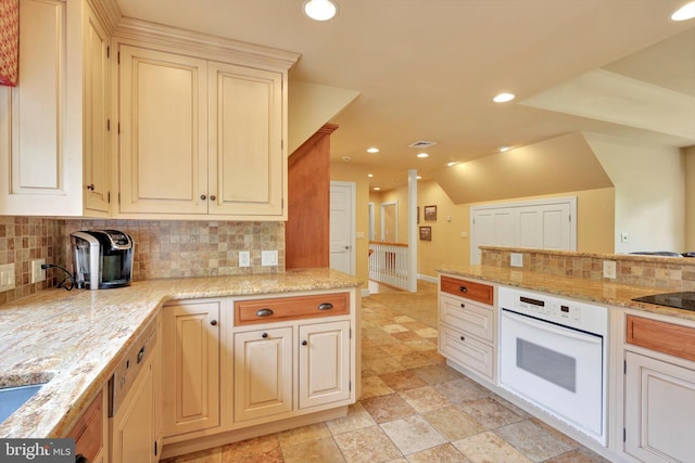 1716 Olmsted Way E, Camp Hill, PA 17011 - kitchen with white oven, backsplash, recessed lighting, light stone countertops, and vaulted ceiling