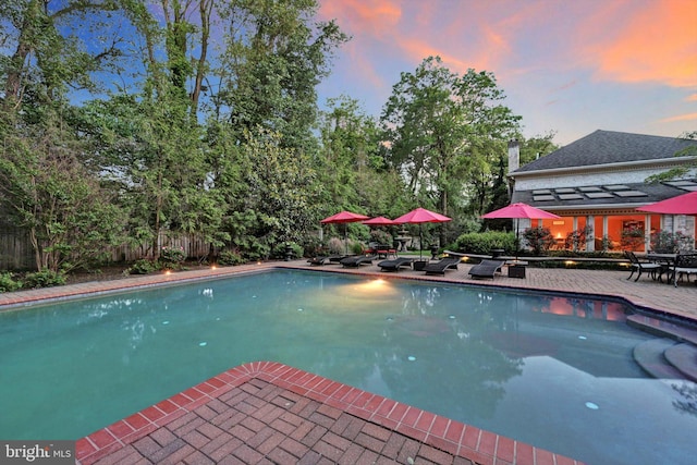 1716 Olmsted Way E, Camp Hill, PA 17011 - pool at dusk featuring an outdoor pool and a patio area