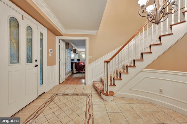 1716 Olmsted Way E, Camp Hill, PA 17011 - entrance foyer featuring light tile patterned floors, crown molding, stairway, inlaid floor details, and wainscoting