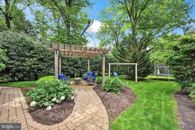 1716 Olmsted Way E, Camp Hill, PA 17011 - view of grassy yard featuring a trampoline, a pergola, a patio, and a playground