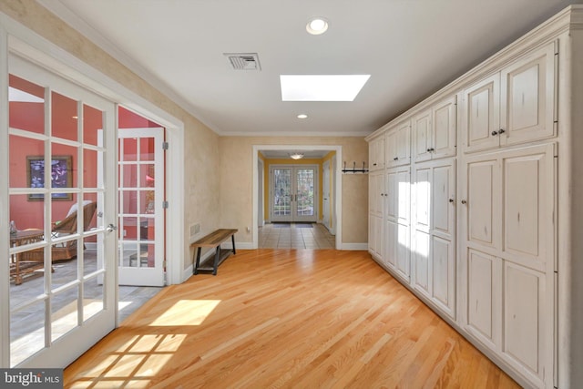 1716 Olmsted Way E, Camp Hill, PA 17011 - hallway with french doors, a skylight, baseboards, crown molding, and light wood-type flooring