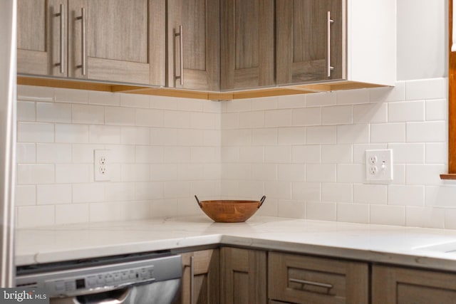 1051 Taylor St, State College, PA 16803 - kitchen with decorative backsplash, stainless steel dishwasher, and light stone countertops