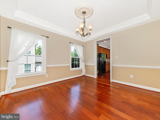 15 Wagon Shed Ln, Middletown, MD 21769 - unfurnished room with a chandelier, a raised ceiling, crown molding, wood finished floors, and baseboards