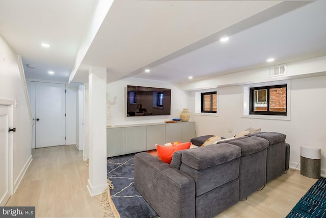 living room with wood finished floors and recessed lighting