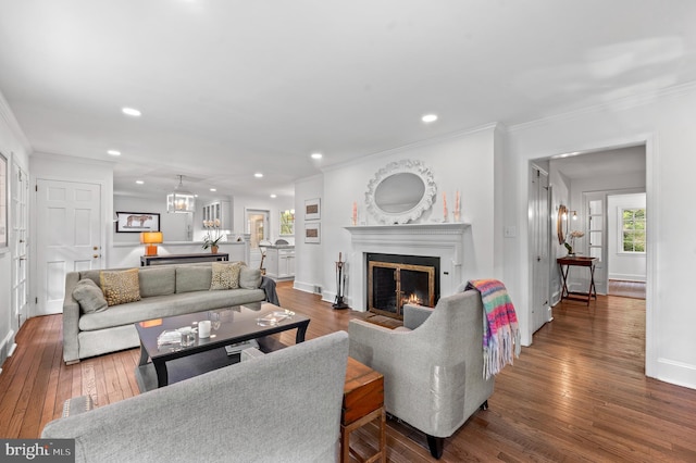 512 Worthington Rd, Chester Springs, PA 19425 - living area with recessed lighting, hardwood / wood-style flooring, baseboards, ornamental molding, and a warm lit fireplace
