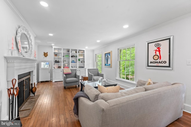 512 Worthington Rd, Chester Springs, PA 19425 - living room featuring ornamental molding, recessed lighting, wood-type flooring, a fireplace with raised hearth, and baseboards