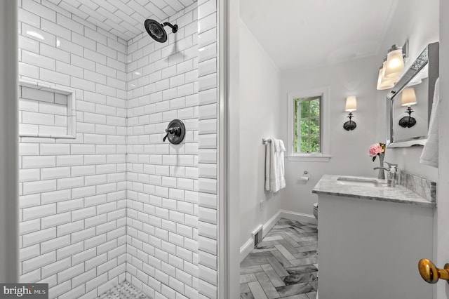 512 Worthington Rd, Chester Springs, PA 19425 - bathroom with crown molding, a tile shower, vanity, and baseboards