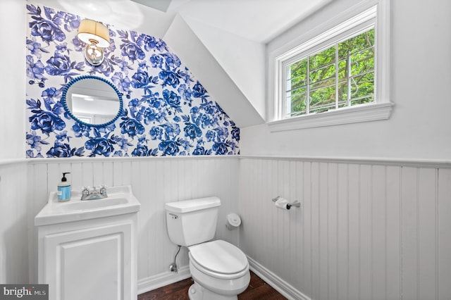 512 Worthington Rd, Chester Springs, PA 19425 - half bath featuring a wainscoted wall, wood finished floors, toilet, and vanity