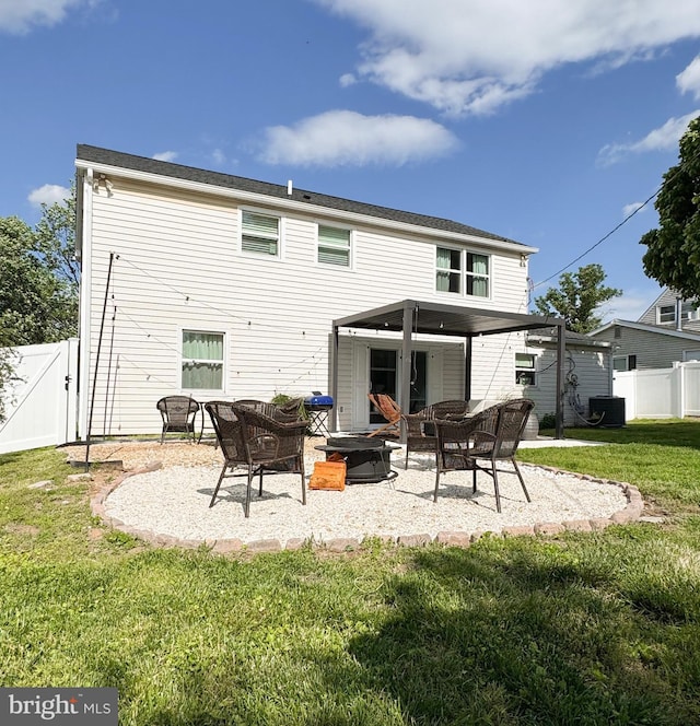 back of property featuring an outdoor fire pit, a patio, a gate, and cooling unit
