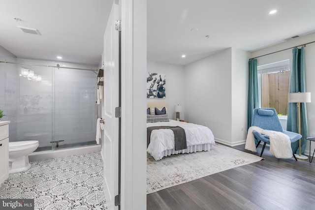 1201 Staples St NE Unit 1, Washington, DC 20002 - bedroom featuring recessed lighting, wood finished floors, ensuite bath, and baseboards