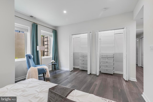1201 Staples St NE Unit 1, Washington, DC 20002 - bedroom featuring dark wood-type flooring, baseboards, recessed lighting, and two closets