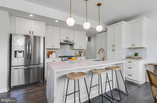 1201 Staples St NE Unit 1, Washington, DC 20002 - kitchen with stainless steel refrigerator with ice dispenser, under cabinet range hood, a sink, gas range, and tasteful backsplash