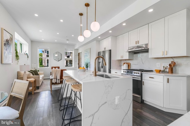 1201 Staples St NE Unit 1, Washington, DC 20002 - kitchen with stainless steel appliances, under cabinet range hood, a sink, recessed lighting, and dark wood-type flooring
