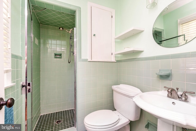 1128 Coventry Rd, Cheltenham, PA 19012 - full bath with a stall shower, toilet, a sink, tile walls, and a wainscoted wall