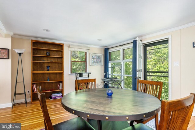 1128 Coventry Rd, Cheltenham, PA 19012 - dining space featuring light wood-style flooring, crown molding, plenty of natural light, and baseboards