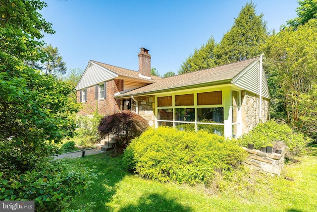 1128 Coventry Rd, Cheltenham, PA 19012 - rear view of house with stone siding, a chimney, and a shingled roof