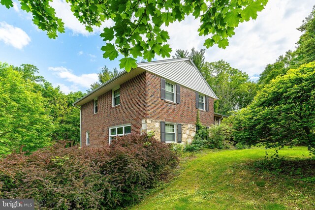 1128 Coventry Rd, Cheltenham, PA 19012 - view of side of home featuring a lawn and brick siding