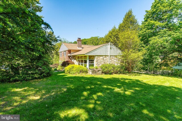 1128 Coventry Rd, Cheltenham, PA 19012 - view of grassy yard featuring a sunroom