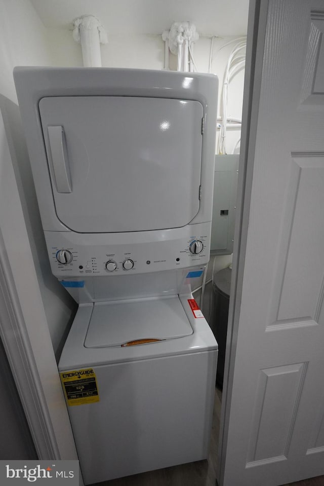 laundry room with stacked washer / drying machine