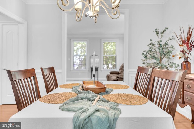 14745 Jennifer Ct, Issue, MD 20645 - dining room featuring a chandelier, light wood finished floors, and ornamental molding