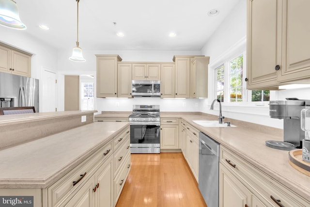 14745 Jennifer Ct, Issue, MD 20645 - kitchen with appliances with stainless steel finishes, cream cabinetry, a sink, light countertops, and recessed lighting