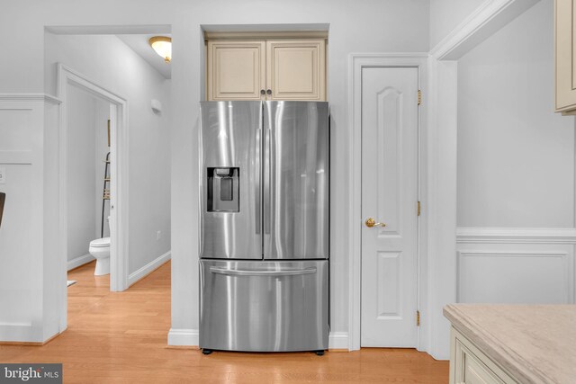 14745 Jennifer Ct, Issue, MD 20645 - kitchen with stainless steel refrigerator with ice dispenser, cream cabinets, light wood-style flooring, and light countertops