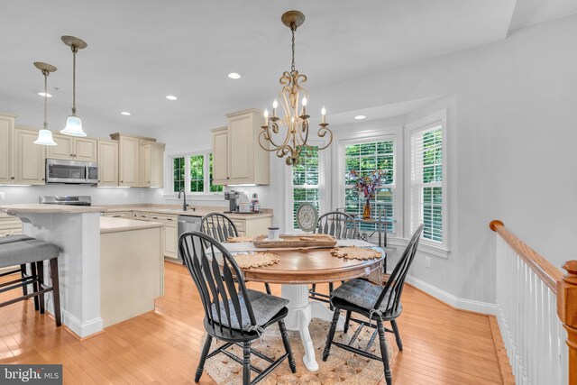 14745 Jennifer Ct, Issue, MD 20645 - dining space with light wood-type flooring, a chandelier, recessed lighting, and baseboards