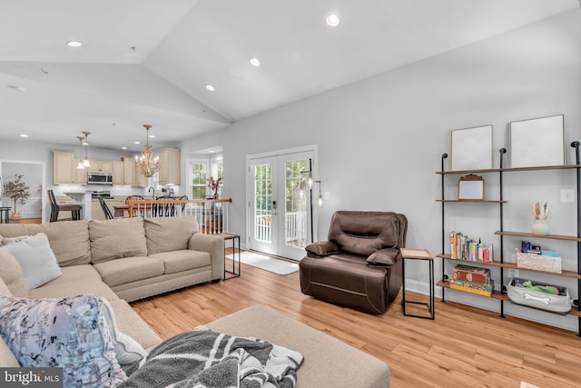 14745 Jennifer Ct, Issue, MD 20645 - living area with light wood-style floors, french doors, lofted ceiling, recessed lighting, and a chandelier