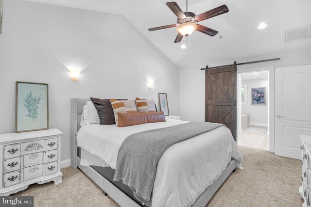 14745 Jennifer Ct, Issue, MD 20645 - bedroom with lofted ceiling, light colored carpet, a barn door, recessed lighting, and connected bathroom