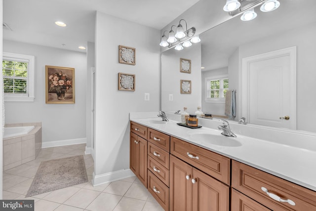 14745 Jennifer Ct, Issue, MD 20645 - full bath featuring tile patterned floors, double vanity, tiled tub, recessed lighting, and baseboards