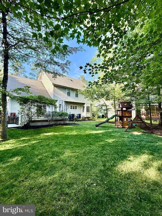 14745 Jennifer Ct, Issue, MD 20645 - view of green lawn with a playground and a wooden deck