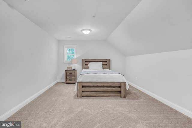 14745 Jennifer Ct, Issue, MD 20645 - carpeted bedroom with lofted ceiling and baseboards