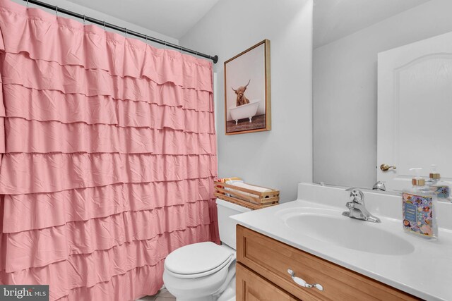 14745 Jennifer Ct, Issue, MD 20645 - full bathroom featuring toilet, vanity, and a shower with curtain