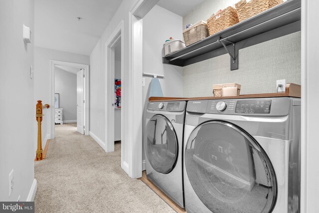 14745 Jennifer Ct, Issue, MD 20645 - laundry room featuring washing machine and clothes dryer, baseboards, and carpet flooring