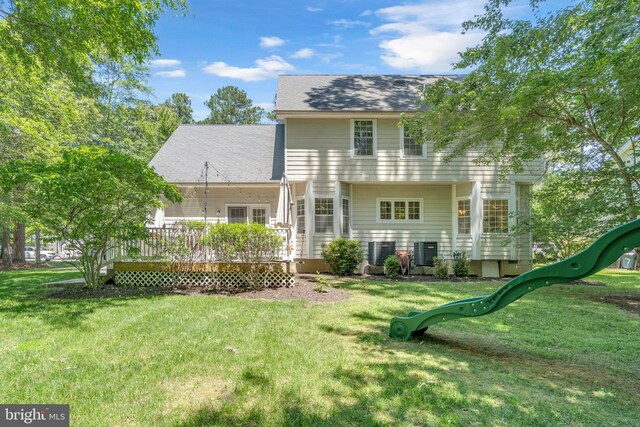 14745 Jennifer Ct, Issue, MD 20645 - rear view of house featuring a playground, a lawn, and a wooden deck